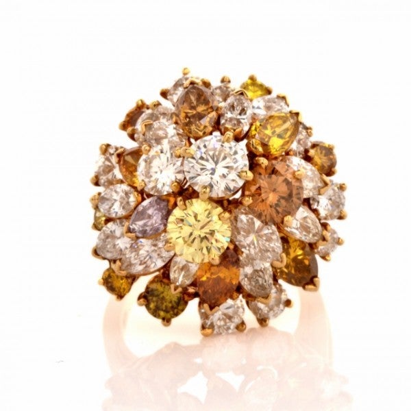 This fascinating estate cluster ring of absorbing aesthetic is crafted in solid 18K yellow gold and weighs approx. 11.00 grams. In absorbing, color-enriched 'dome' design, this captivating estate ring exposes an extravagant cluster of genuine