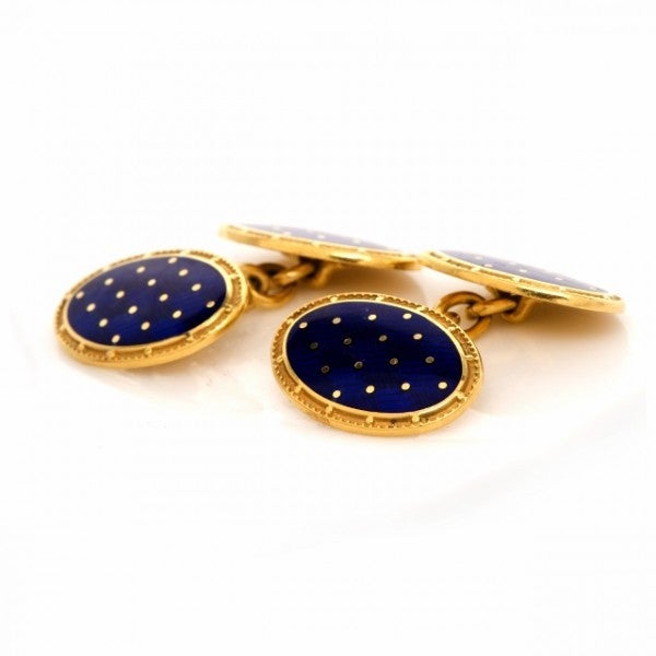 These classically distinguished cuff-links of English provenance are crafted in solid 18K yellow gold, weigh 17.2 grams and measure 20mm long and 10mm wide. These designer cuff-links incorporate classically elegant ovular plaques embellished with