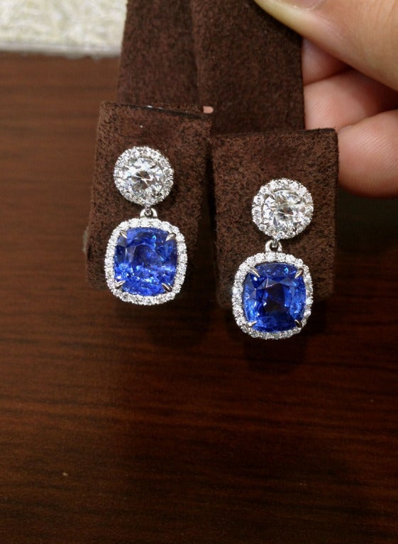 Beautiful and unique cushion shape sapphire drops weighing 7.62 carats. 

The sapphires are NATURAL and have NO EVIDENCE OF HEAT certified by GIA. 

The sapphires are set with 1.68 carats of round diamonds and micro pave detail. 

The