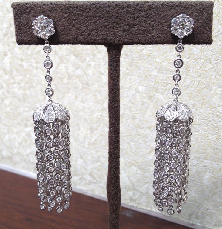 A unique pair of tassel earrings to add to any collection. 7.95 carats of beautiful round diamonds set in 18k white gold.