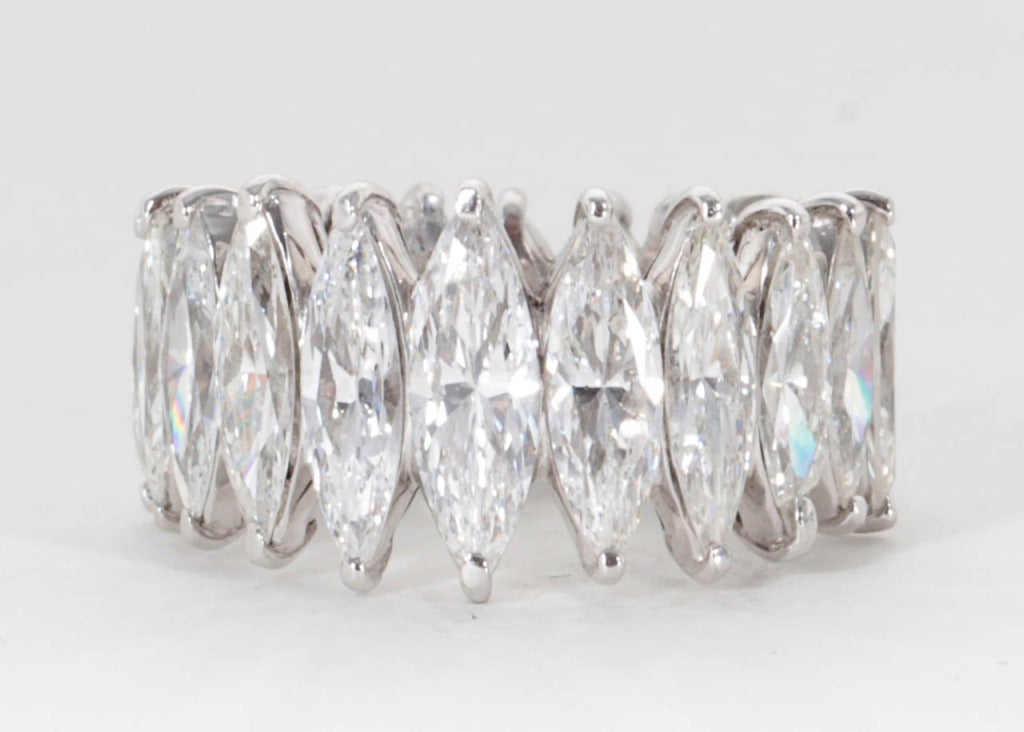 A rare and unique find!

Marquise diamond eternity band set in platinum -- approximately 12.5 mm wide in the center!

Approximately 13 carats of marquise shaped diamonds that graduate down in size.

Size 6.5 -- the finger size can be adjusted. 