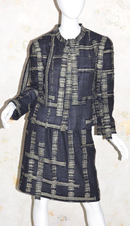 Chanel black gold fantasy tweed suit hanging ribbons 2006A SZ 44. Suit has been altered.