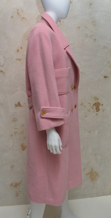 Vintage Chanel pink wool overcoat. Boxy fit, fully lined with a belted back. Beautiful condition. Signature gold buttons.