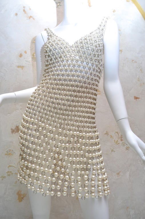 Paco Rabanne original French couture metal and pearl link dress. Jewelry to wear. High grade costume pearls in 3 sizes and metal links make up this rare and important dress. Indisputable quality, the dress is heavy and substantial. Closes with 4