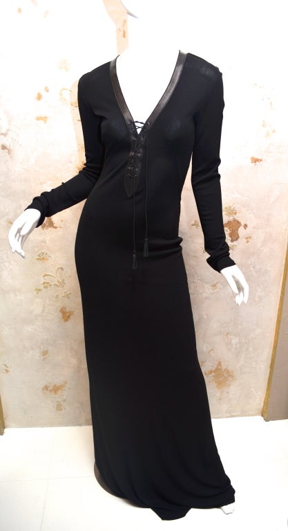 Gianni Versace Versus Rayon Matte Jersey Evening Gown with Leather trim at neckline and braided leather lace up the front. Unworn but original tags have been removed. Bias cut jersey will fit a several sizes but it is meant for a size 8 or Italian