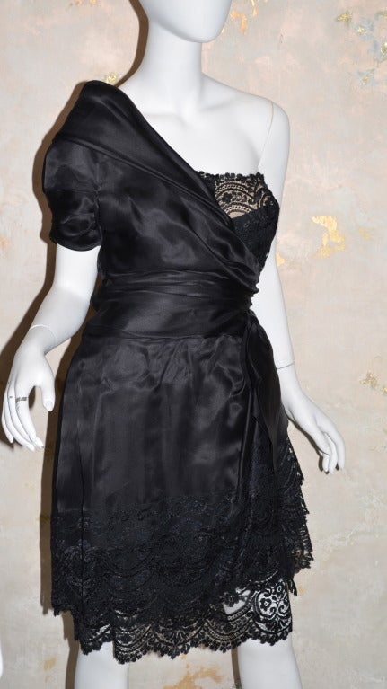 Paul Louis Orrier Silk & Lace One Shoulder Cocktail Dress
Very lightweight, boned bodice, side zipper. Bow at waist. Black silk and black lace. 
Excellent condition.