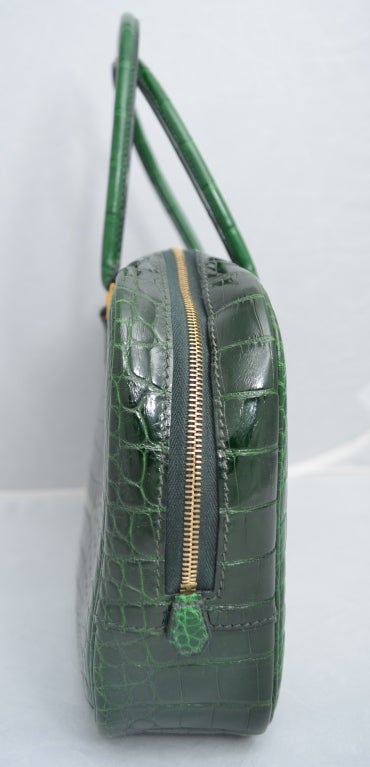 Hermes vert fonce crocodile Plume handbag with gold hardware. Gorgeous inside and out. Measures 28 cm or 11