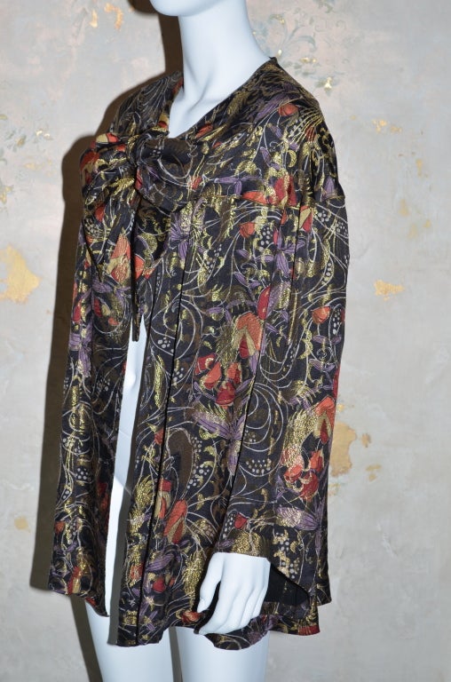 Liberty & Co multicolored patterned lame (metal thread) evening coat from the 1920's or the 1930's. Stunning color combination with lavender, red, gold and black. Chiffon lining with Liberty embroidered in collar. One size. Long ties at front collar