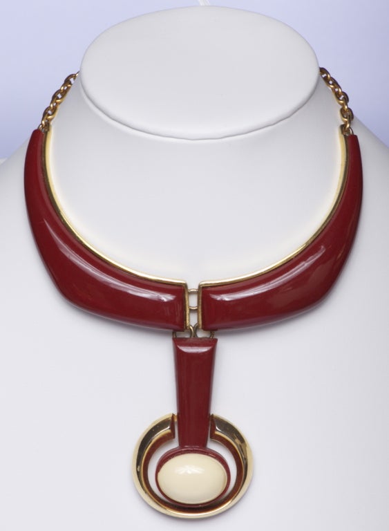 Very rare Lanvin vintage mid century modern choker with 3 articulated pieces and chain back. Gold metal with rust and cream plastic insets. Sculptural shape with raised and curved shape. Fabulous design with 3 moving parts that are linked together
