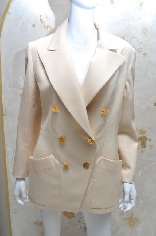 Chanel off white double breasted tailored jacket with gold cut out CC logo buttons. Size 44, excellent condition. Great basic piece.