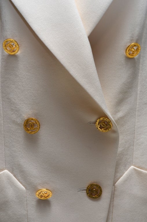 white jacket with gold buttons