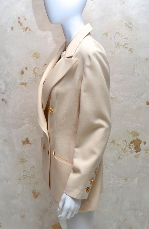 white blazer with gold buttons