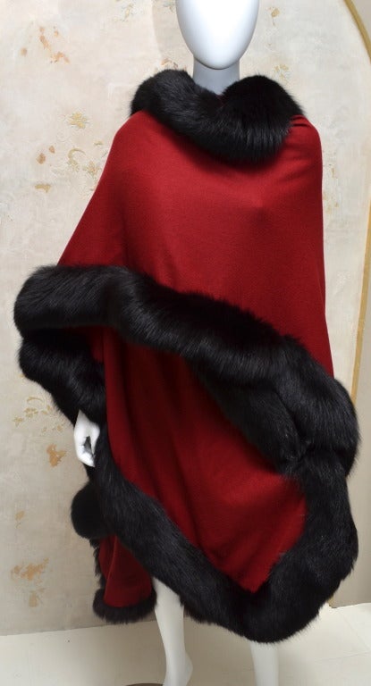 Edwards-Lowell of Beverly Hills cashmere cape / wrap with black fox fur trim. Made of soft and luxurious cashmere with fox fur trim.  Striking, glamorous piece.