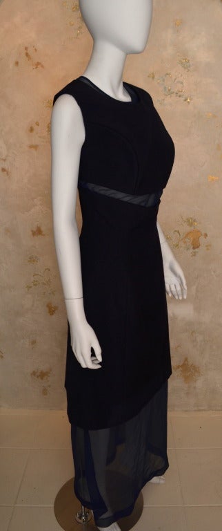 Comme des Garcons dress from 1997. Black structured wool day dress and navy blue chiffon gown, peek a boo mid drift. Very structured bodice gives the illusion of a large chest.
In mint condition.