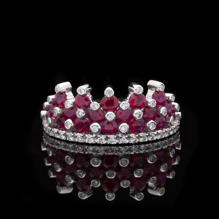 Favero 18Kt White Gold Ring features 18 Round Brilliant Cut Rubies for approximately 1.44cts with 46 Round Cut side Diamonds for approximately 0.25cts.  Ring is a size 6.5 and weighs 5.27 grams.
