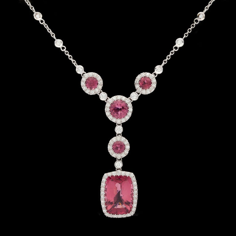 Favero Pink Tourmaline & Diamond Necklace, set in 18Kt White Gold and features 5 Mixed Cut Tourmalines for approximately 7.50cts accented by approximately 0.78cts of Round Brilliant Cut Diamonds.  Necklace weighs 13.5 grams, and the chain measures