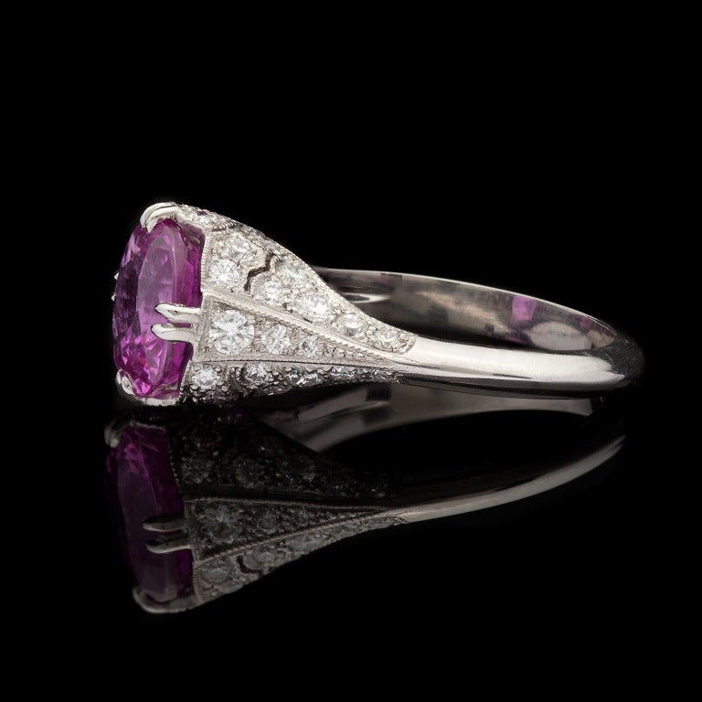 Custom ring features a Cushion Cut Natural Pink Sapphire for 3.64cts and 44 Round Cut Diamonds with a total approximate weight of 0.88cts in a Platinum setting. The total weight of the ring is 6.2 grams and is a size 7.  Sapphire has not been heated