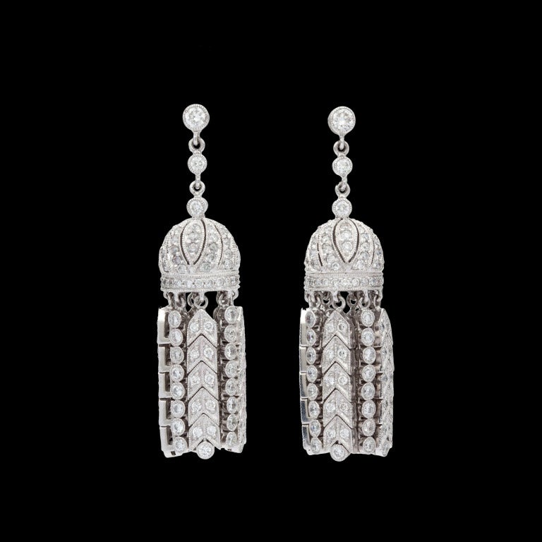 Platinum Diamond Chandelier Tassel Earrings with 318 Round Brilliant Cut Diamonds for approximately 4cts that measure 10mm x 43mm and weigh 23.9 grams.
