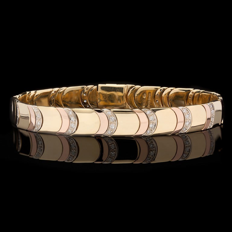 Chimento 18Kt Tri-Color Gold Diamond Bracelet features 60 Round Brilliant Cut Diamonds for approximately 0.45cts.  Bracelet measures 7.25″ long and 8mm in width, with a weight of 28.4 grams.