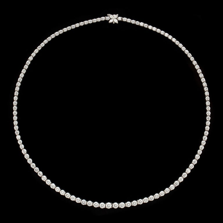 Tiffany & Co. Platinum Diamond necklace features 121 Round Brilliant Cut and 4 Marquise Cut Diamonds for a total approximate weight of 10.45cts.  The length is 16.5 inches measuring between 3-4mm in width and has a 6.5mm clasp width.  The necklace