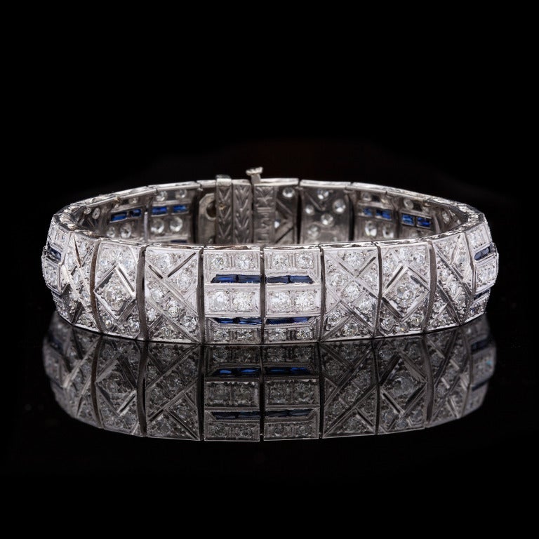 Art Deco Diamond & Sapphire Bracelet features 151 Round Cut Diamonds for approximately 6.75cts & 40 Sapphires set in Platinum.  Bracelet measures 6.75