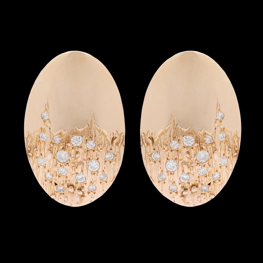 18Kt Yellow Gold estate earrings are set with 30 brilliant cut round Diamonds totaling approximately 1.35 carats.  The earrings measure 36 x 23mm and weigh 20.4 grams.