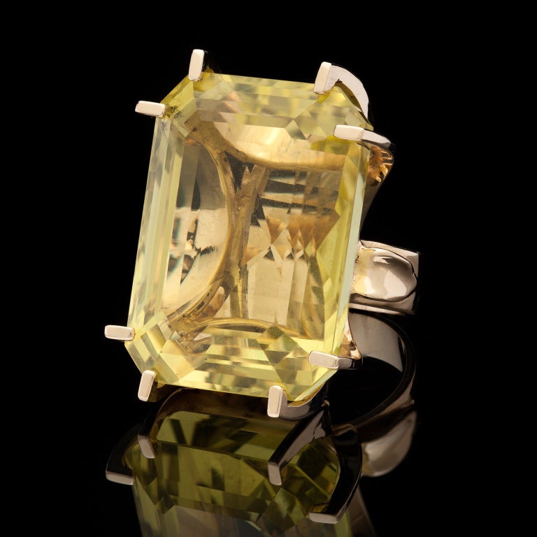 Beautiful Estate Ring with Oversized Citrine Set in 18Kt Yellow Gold.  The Stone is Emerald Cut and Measures 31 x 22mm.  The ring is a size 7.5 and weighs 35 grams.