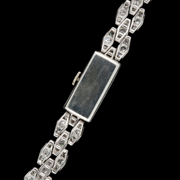 French Platinum Rectangular Face Diamond Watch with 161 Single Cut Diamonds for a total approximate weight of 5.50cts and weighs 29.9 grams.  Watch is manual with an engraved head that measures 10 x 23mm and has a 7