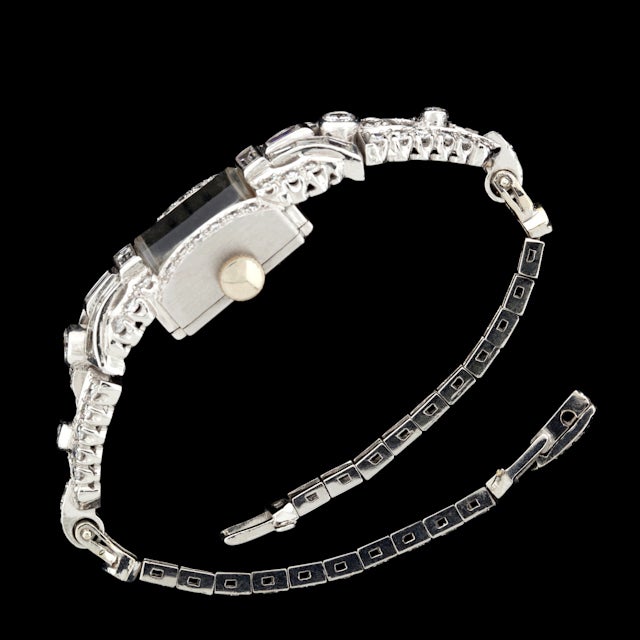 Hamilton Diamond Watch in 14Kt White Gold & Platinum with 98 Mixed Cut Diamonds for a total approximate weight of 2.24cts and weighs 28.6 grams. Watch is manual and head measures 14mm x 34mm and has a 6.5