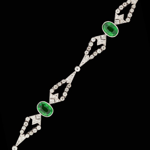 Custom 18KT White Gold Tsavorite & Diamond bracelet weighing 15.6 grams.  Bracelet is made of 4 Oval Cut Green Tsavorites for a total approximate weight of 8cts with 187 Round Cut Diamonds for a total approximate diamond weight of 2.10cts.
Bracelet