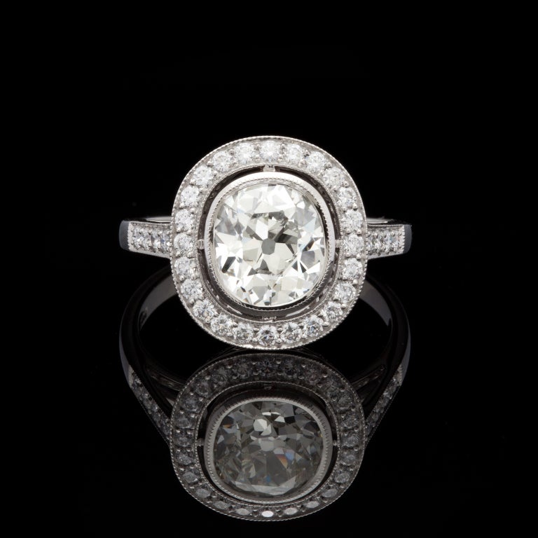 Custom made Platinum ring features a 1.79ct Old Mine Cut Diamond with L color and VS2 clarity, complete with GIA Grading Report for the center stone, accented by 24 Round Brilliant Cut Diamonds for approximately an additional 0.38cts.  Ring is a