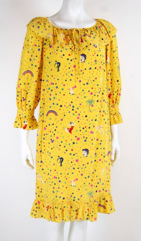 Emanuel Ungaro's fashion is bold, colorful, and exuberant. For forty years, his innovative designs have graced Paris runways.

Here's a vintage loose-fit dress with a playful carnival print featuring clowns, dancers, rainbows and palm trees