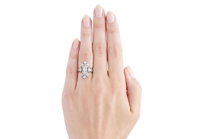 Avalon is lovely, hand crafted vintage Art Deco engagement ring made from platinum, centering three Old European cut diamonds set vertically within a marquise shape frame with a total approximate weight of 0.17ct, graded F-G color and VS2-SI1