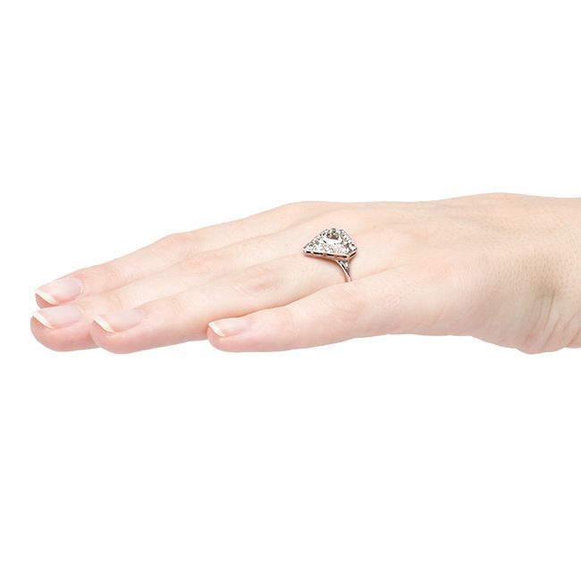 Winthrop is a house favorite at Trumpet & Horn! This showstopping vintage Art Deco era engagement ring is made from platinum and centers a 0.73ct bezel set EGL Certified Triangular Cut diamond graded G color and VS1 clarity. Fourteen bezel set