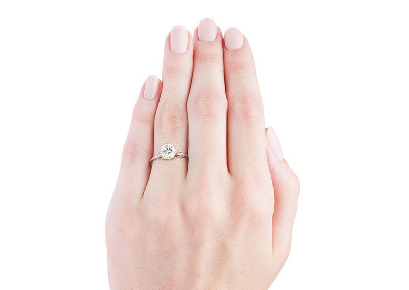 Lyons is a classic Edwardian engagement ring made from platinum featuring a 1.39ct EGL certifed Round Brilliant cut diamond with K color and SI3 clarity. This simple and elegant setting shows off the solitary center diamond by seating it way up high