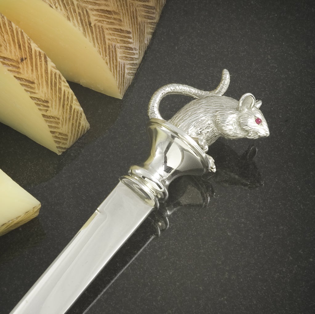 This adorable cheese knife is part of the $18,000 Cheese Dish set, but has proved so popular we have been persuaded to sell it separately.

 The whole knife including the blade is solid sterling. Most cheese knives have stainless steel blades, but