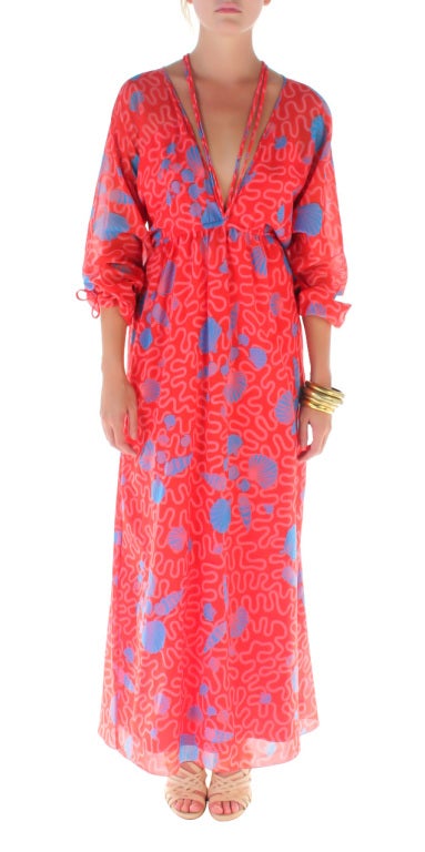 Fantastic Zandra Rhodes red cootton caftan with a blue and pink squiggle print.  My favorite part is the halter strap at the neck.  Ms. Rhodes is such an icon and a talent, in 1969 fresh out of school, she designed the amazing clothes worn by the
