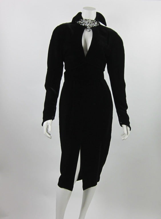 90s Thierry Mugler Black Velvet fitted dress with swaroski colar neck. Button snap all the way at the back.
Dress is lined in Silk and it comes with Belt.