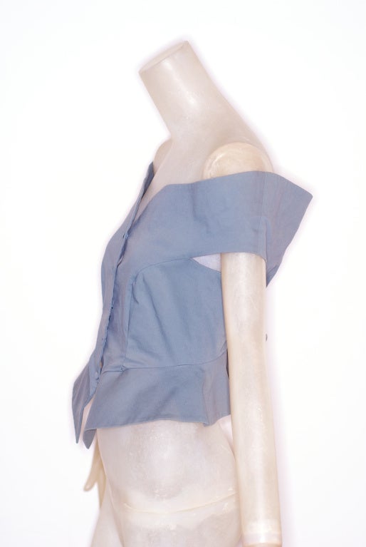 1980s Romeo Gigli Peplum Top in a dove grey.  Top sits slightly off the shoulders.  Can be worn alone or layered over a fitted top.