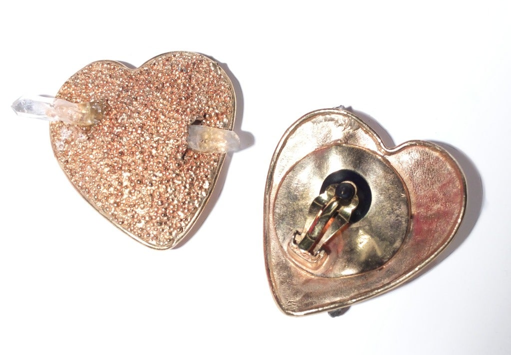 A wonderful pair of mottled gilt hearts with a rock crystal pear through the hearts by Yves Saint Laurent.  Earrings are clip ons and are unsigned.