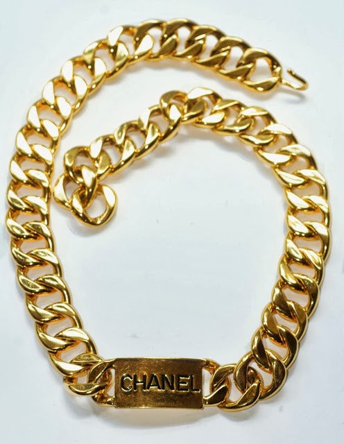 The classic Chanel logo chain belt.

Karl Lagerfeld for Chanel.

29