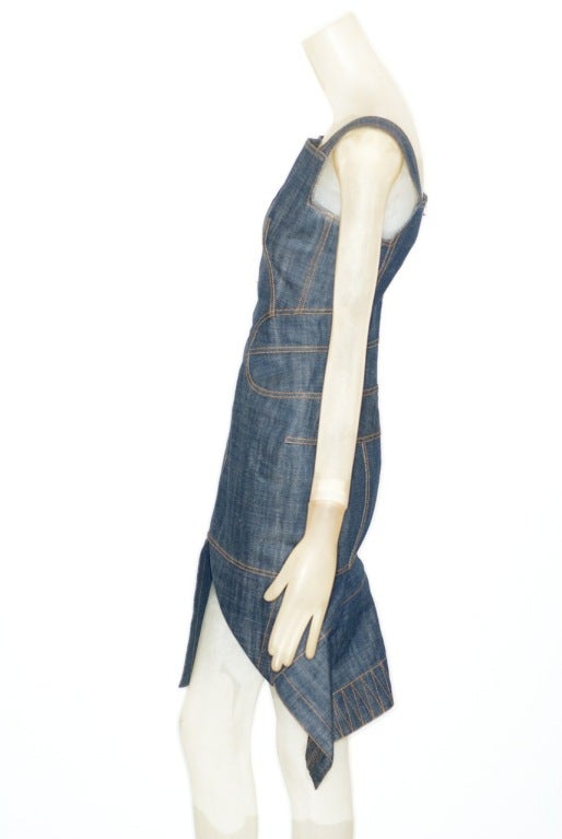 Fantastic and iconic Azzedine Alaia denim dress with 'contour' stitching in a turmeric color tracing and defining the body.  Superb fit, cut and craftsmanship.  Size Medium.

Azzedine Alaia is currently the subject of a retrospective at the Musée