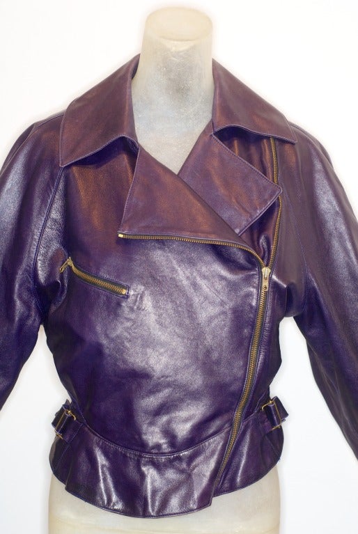 Azzedine Alaia deep amethyst leather motorcycle jacket with a fitted waist.  

Azzedine Alaia, the Tunisian born couturier and historian of couture, has been perfecting his technique of beautifully cut and draped clothes spun from the female form