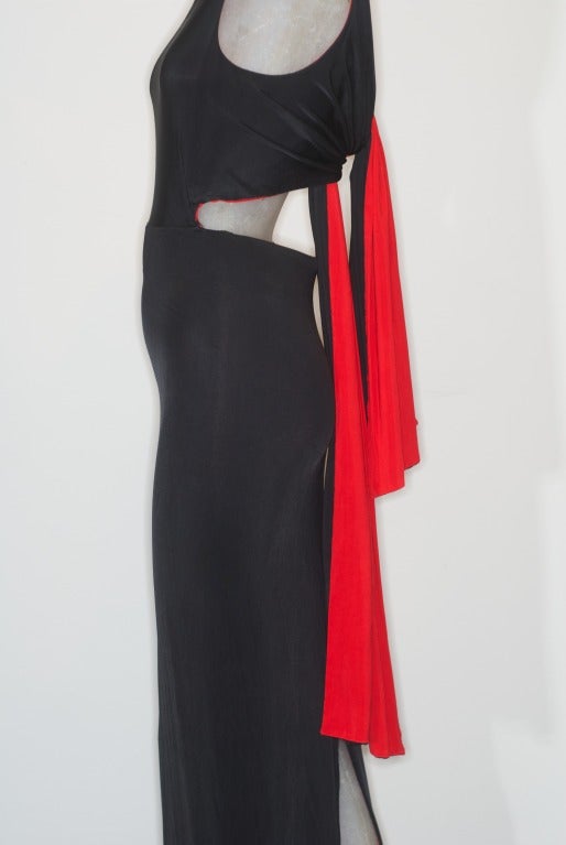 A sleek and form-fitting black and red jersey dress from Gianfranco Ferre circa 1990s.  Open back.