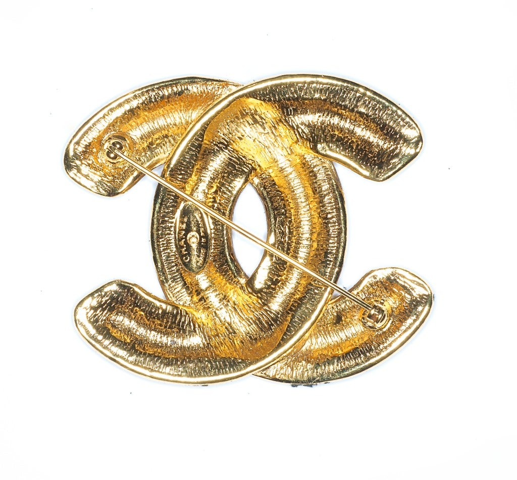 A Large Vintage Quilted Gilt CC Logo Brooch