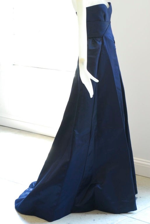 A rare and exceptional 1960s Roberto Capucci Ball Gown.  This Capucci ball gown dates from the period when Capucci left Rome and opened an atelier in Paris on the rue Cambon between the years 1962-1967.

In a deep, inky midnight blue silk it's