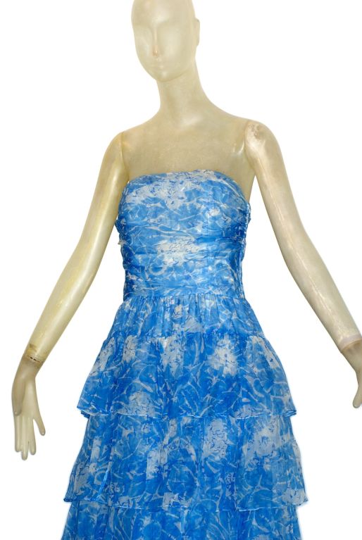 A very beautiful, flirty and feminine cornflower blue silk organza 1970s Guy Laroche gown.  Strapless with ruffled layers.  An ideal summer frock or a something blue wedding gown!