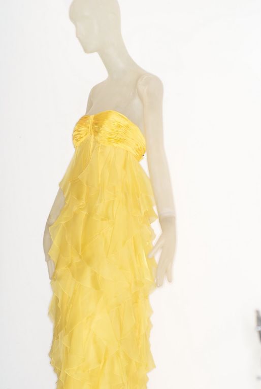 Beautiful silk ruffled gown with a draped bodice by the master of the gorgeous gown: Valentino.  This beauty is haute couture and is as light of air.  Not a dress that comes around every day!