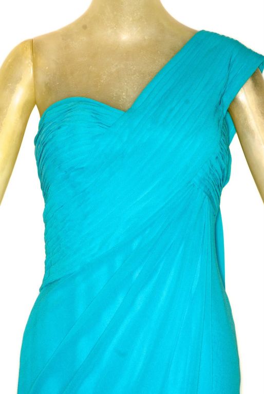Beauitful and elegant turquoise colored Christian Dior haute couture gown with a draped bodice and flowing panel down the back.