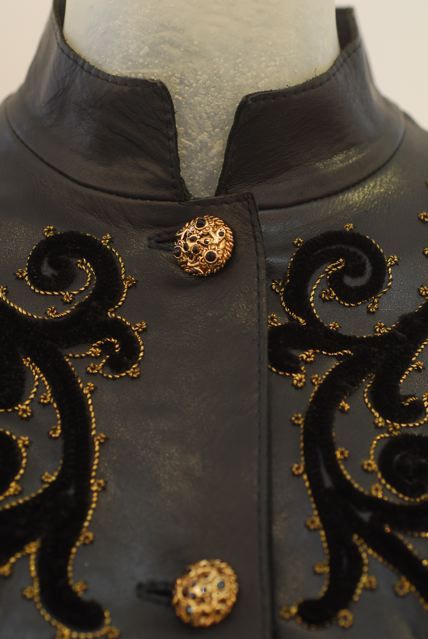 Amazing 1970s English Cordoba leather jacket with embroidery and black jeweled buttons.  The ultimate rich hippie look!  Perfect condition!